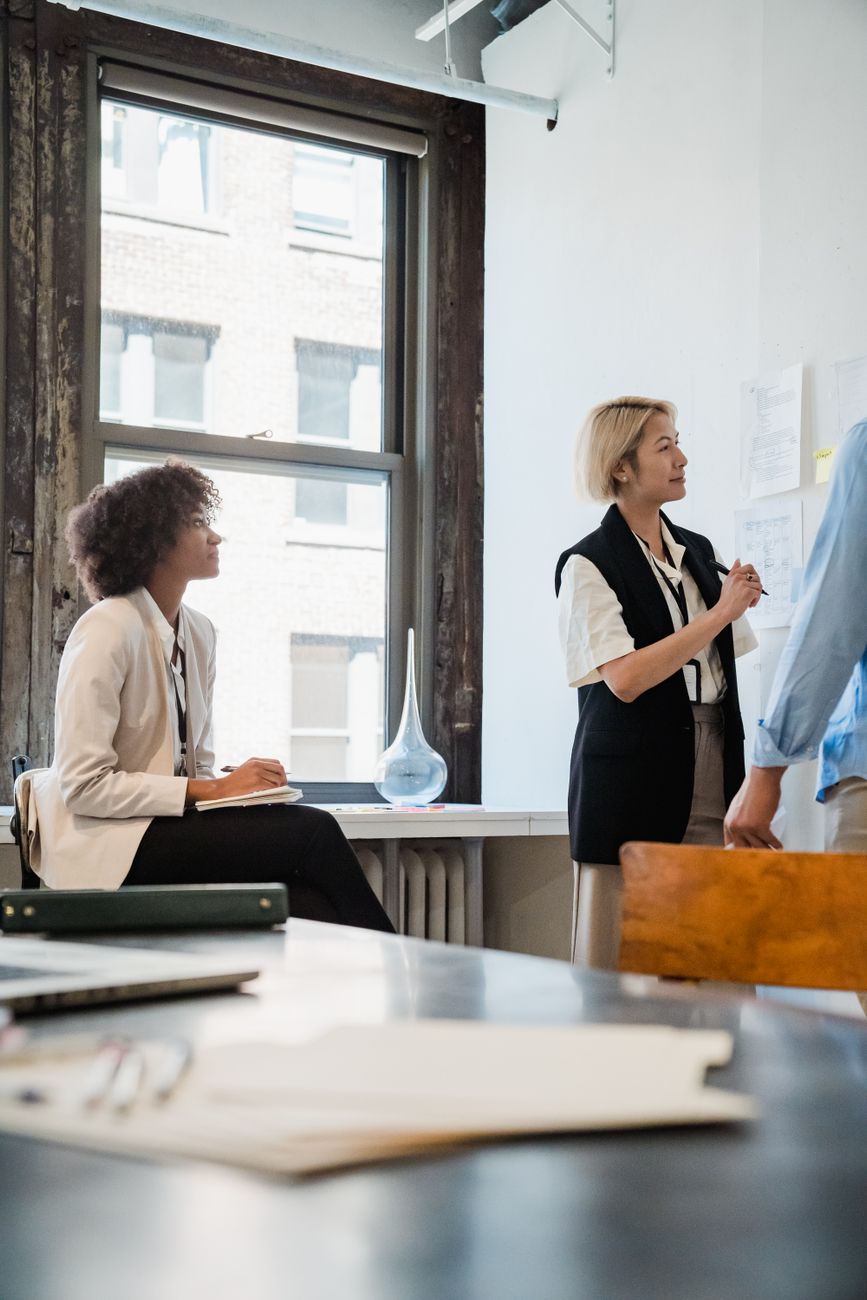 Professional team reviewing information in a modern workspace.